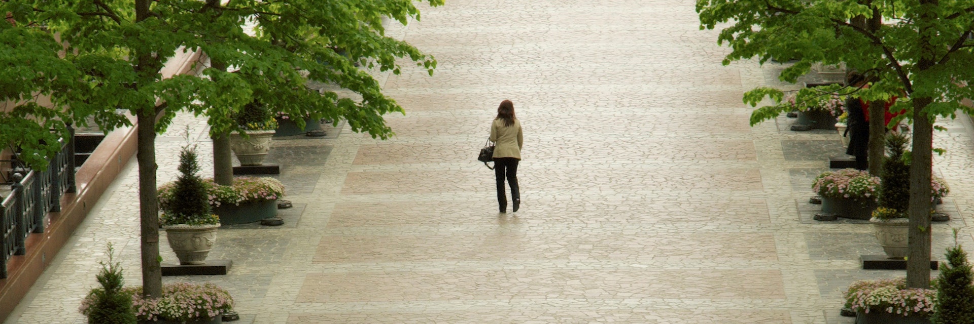 Woman walking through Yebisu Garden Place, Ebisu.