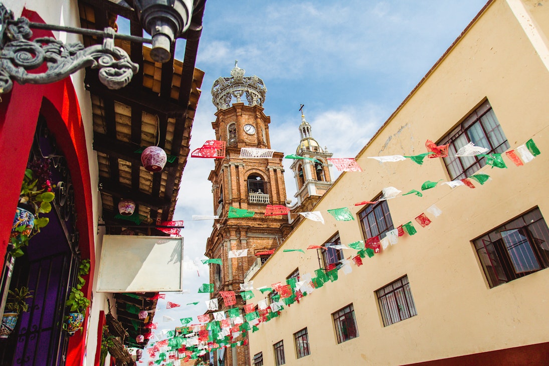 Church Steeple and Flags in street
