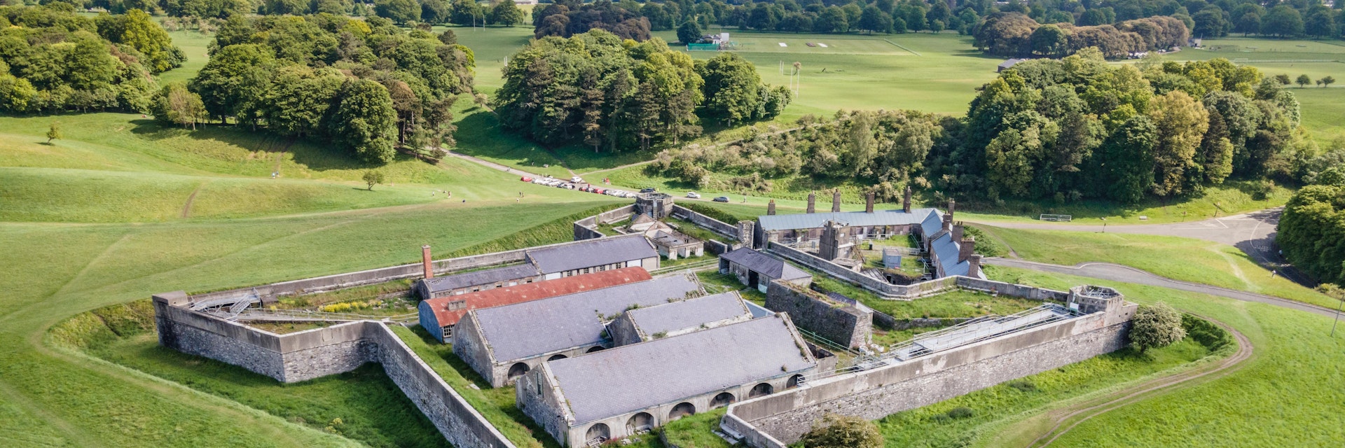 Drone aerial view over the old magazine fort in Phoenix Park, Dublin, on a bright sunny day with green grassy slopes all around
Magazine Fort