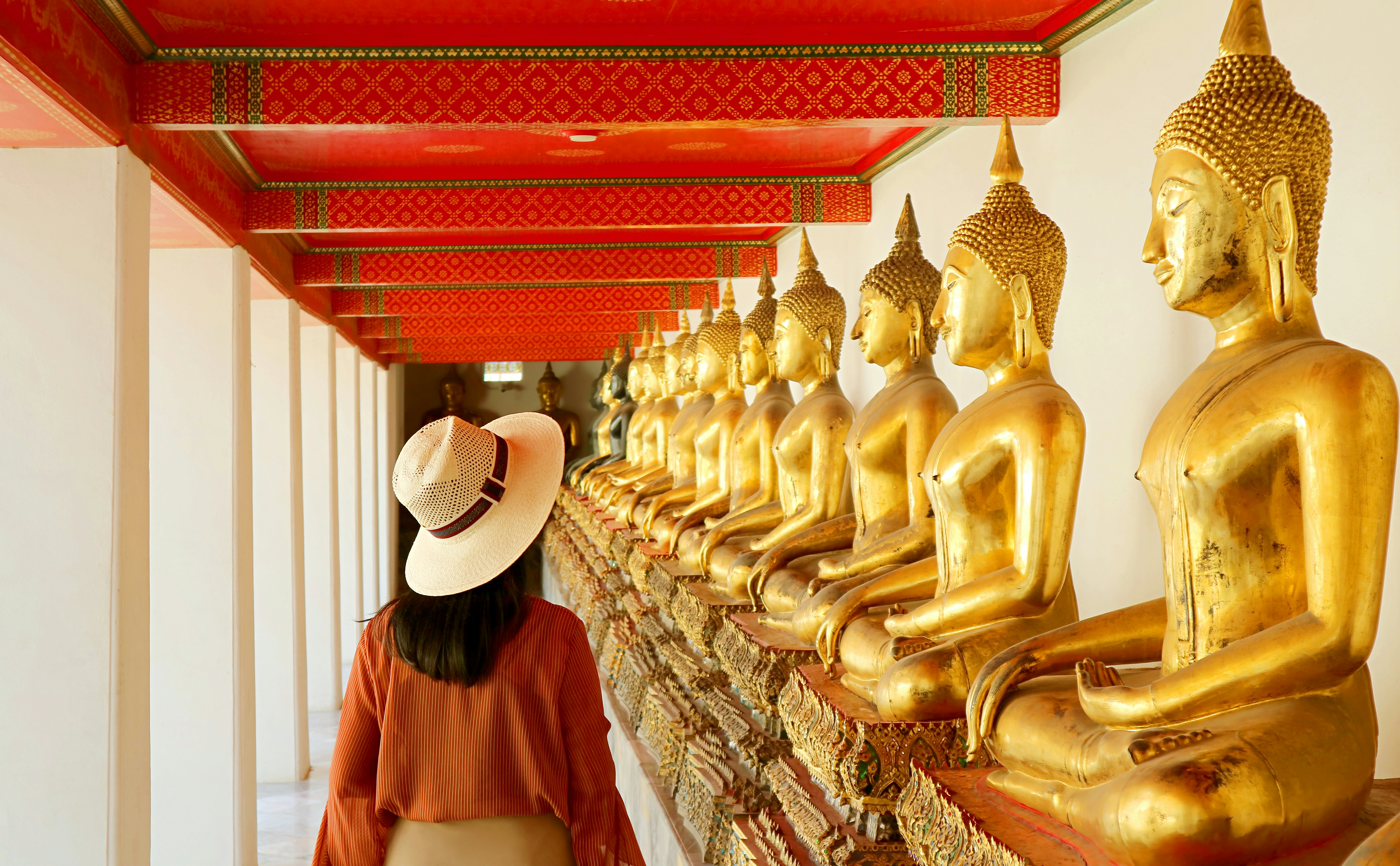 Female Visiting the Cloister with Large Group of Seated Buddha Images in Wat Pho or Temple of the Reclining Buddha, Bangkok Old City, Thailand, ( Self Portrait )