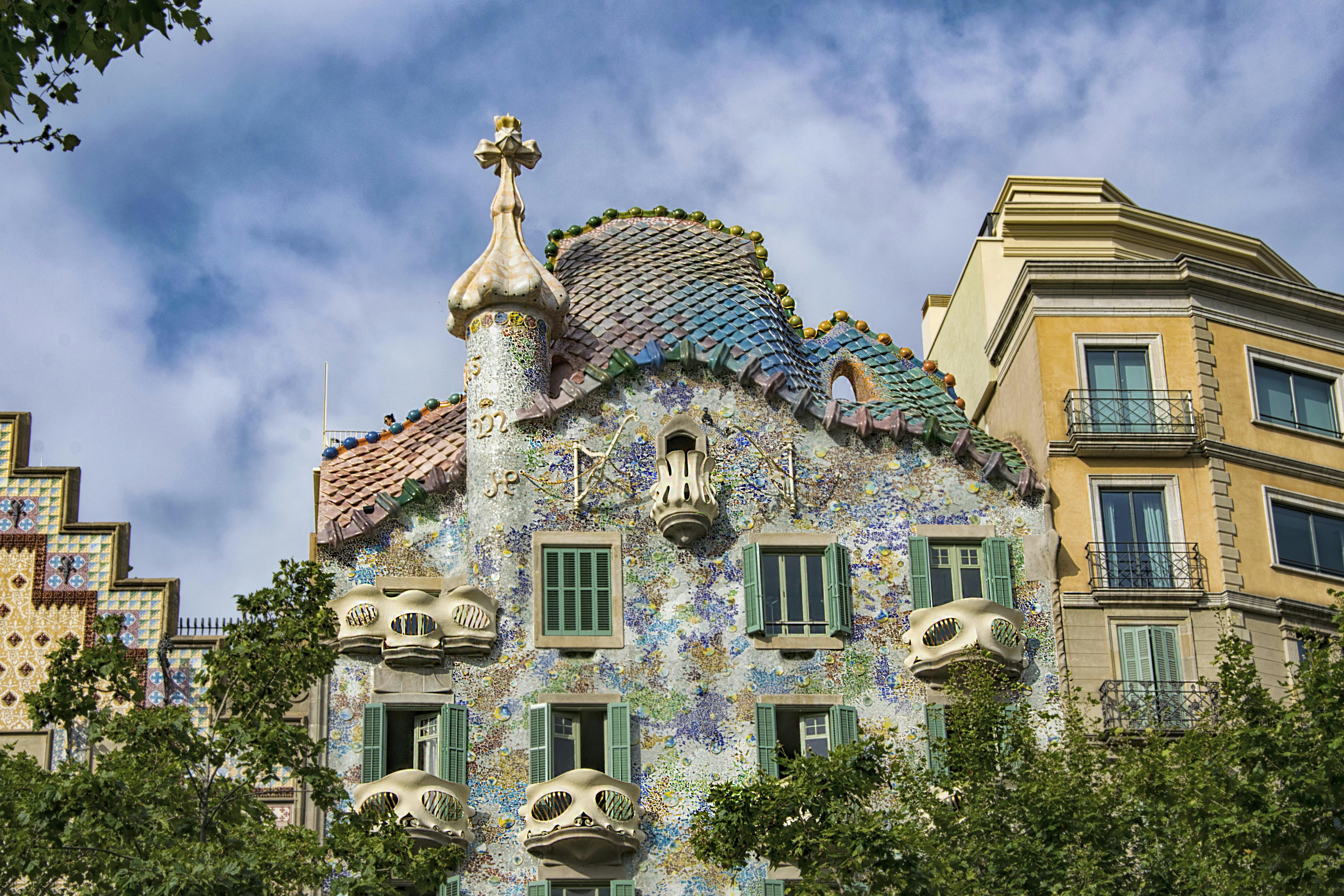 Barcelona, Casa Batlló is one of the two great buildings designed by Antoni Gaudí on Passeig de Gràcia From the outside the façade of Casa Batlló looks like it has been made from skulls and bones.