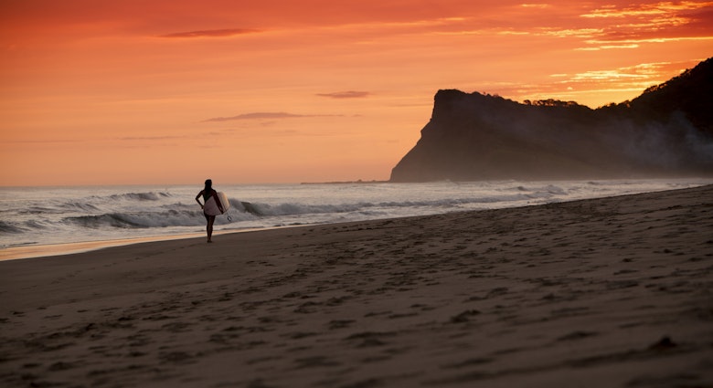 A silhouetted surfer walks down a beach in Nicaragua on sunset during a balmy June afternoon.
181097906
Back Lit, Beach, Carrying, Cloud, Cloudscape, Day, Dusk, Female, Graduated, Hill, Horizontal, Illuminated, Leisure Activity, Mountain, Multi Colored, Nicaragua, Night, One Person, Outdoors, Recreational Pursuit, Reflection, Sand, Sea, Solitude, Summer, Sun, Sunbeam, Sunlight, Surf, Surfboard, Surfing, Travel Destinations, Tropical Climate, Vacations, Walking, Water Sport, Wave, Wave Pattern, Women