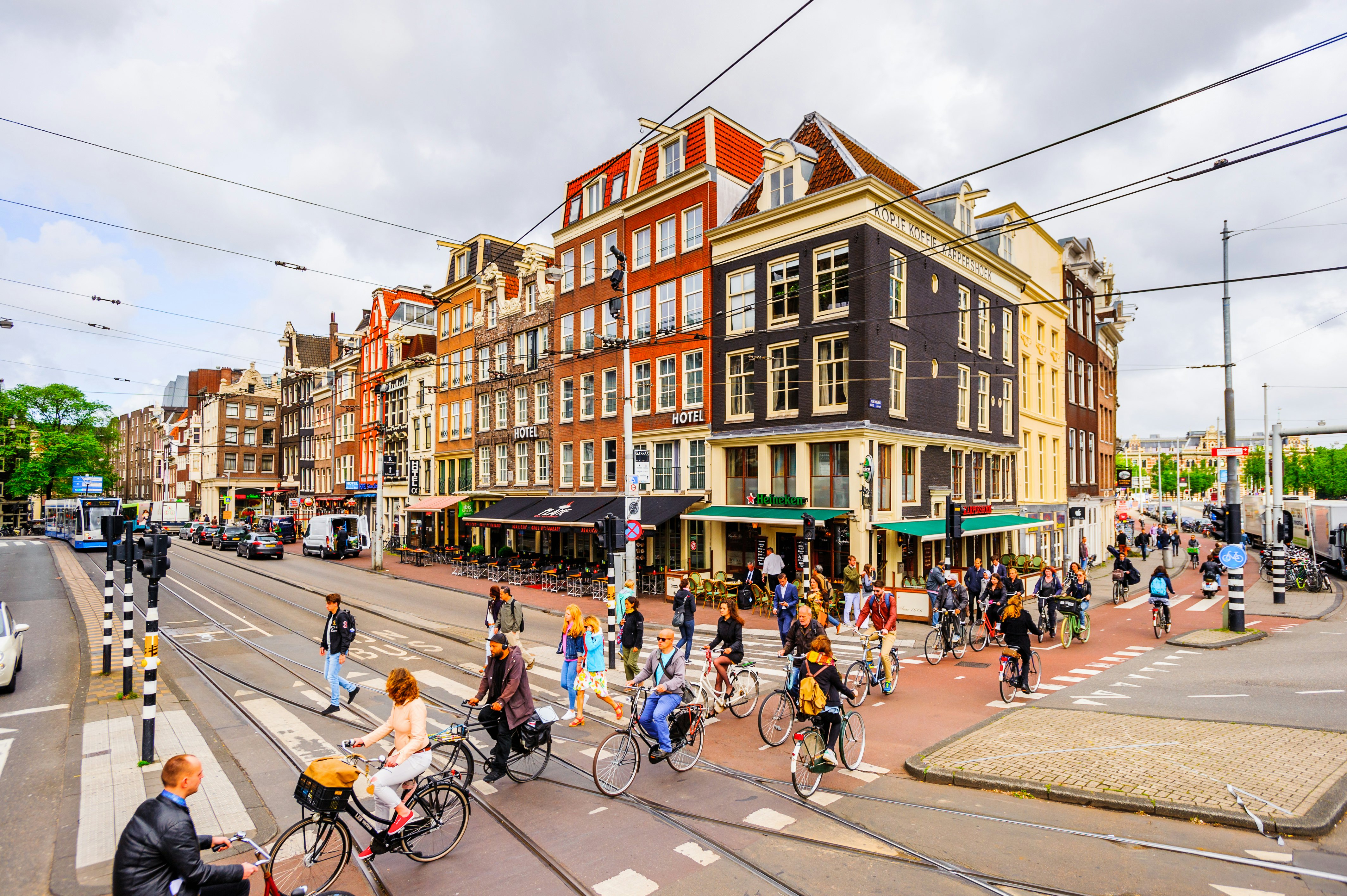 Cyclists riding bikes on dedicated lanes through a city
