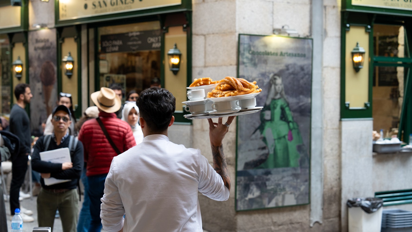 APRIL 29, 2024: Chocolatería San Ginés is a popular restaurant in Madrid for churros and chocolate. It's been servicing customers since 1894. Here, waiters prepare and bring diners their churros.
Spain Marketing 1379722