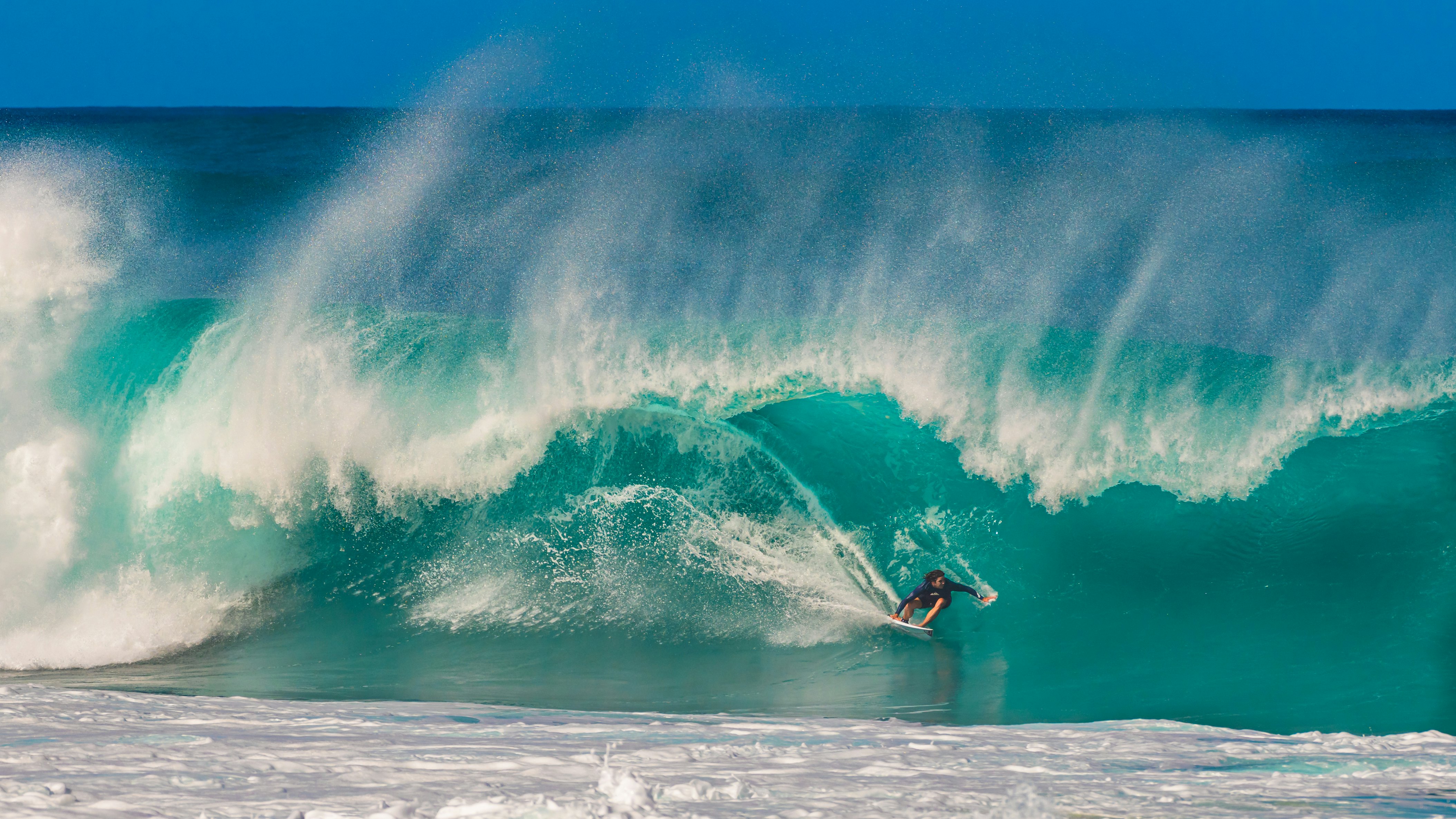 A surfer at the Banzai Pipeline on the North Shore of Oʻahu