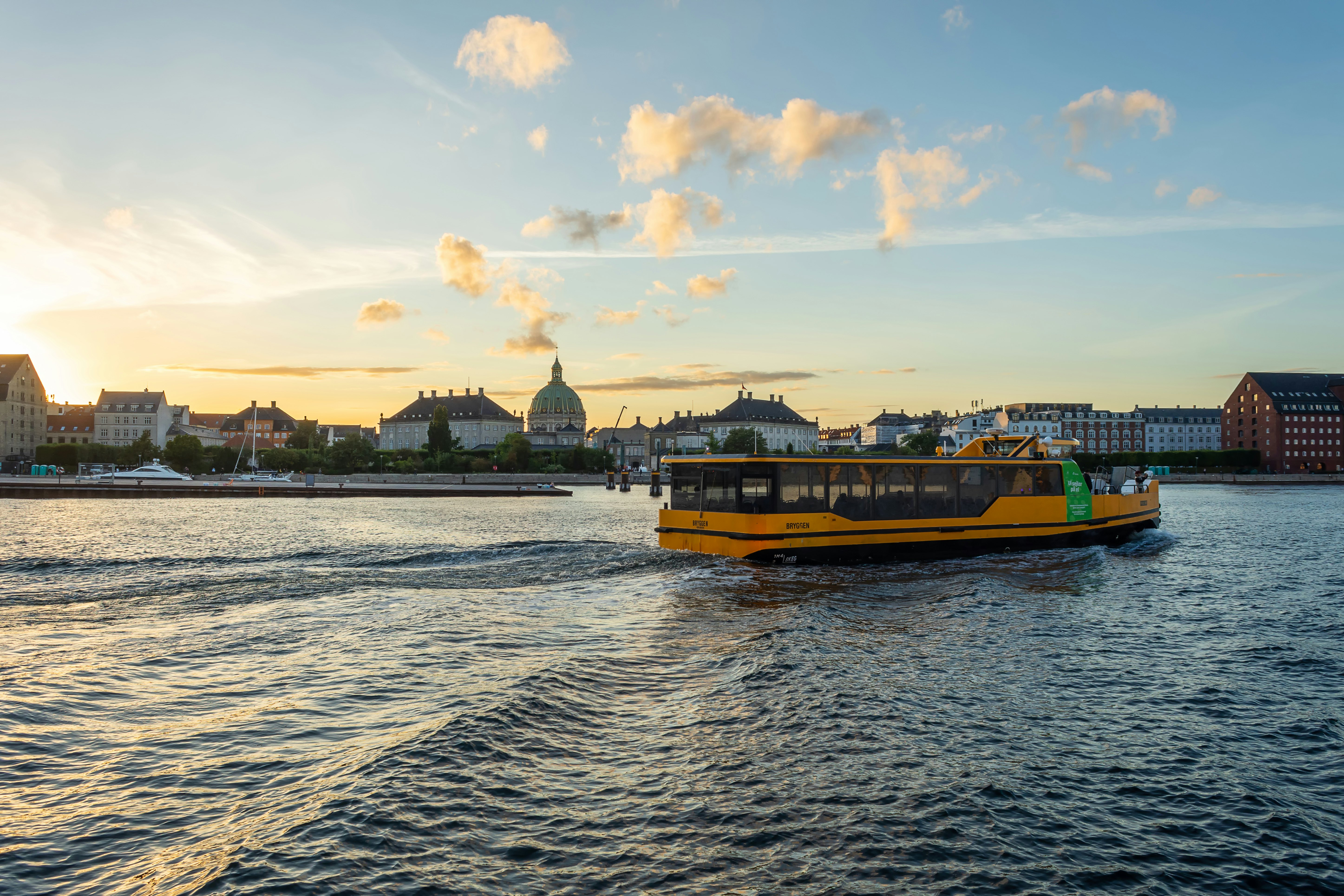 Copenhagen harbor bus on the water in Copenhagen at dusk