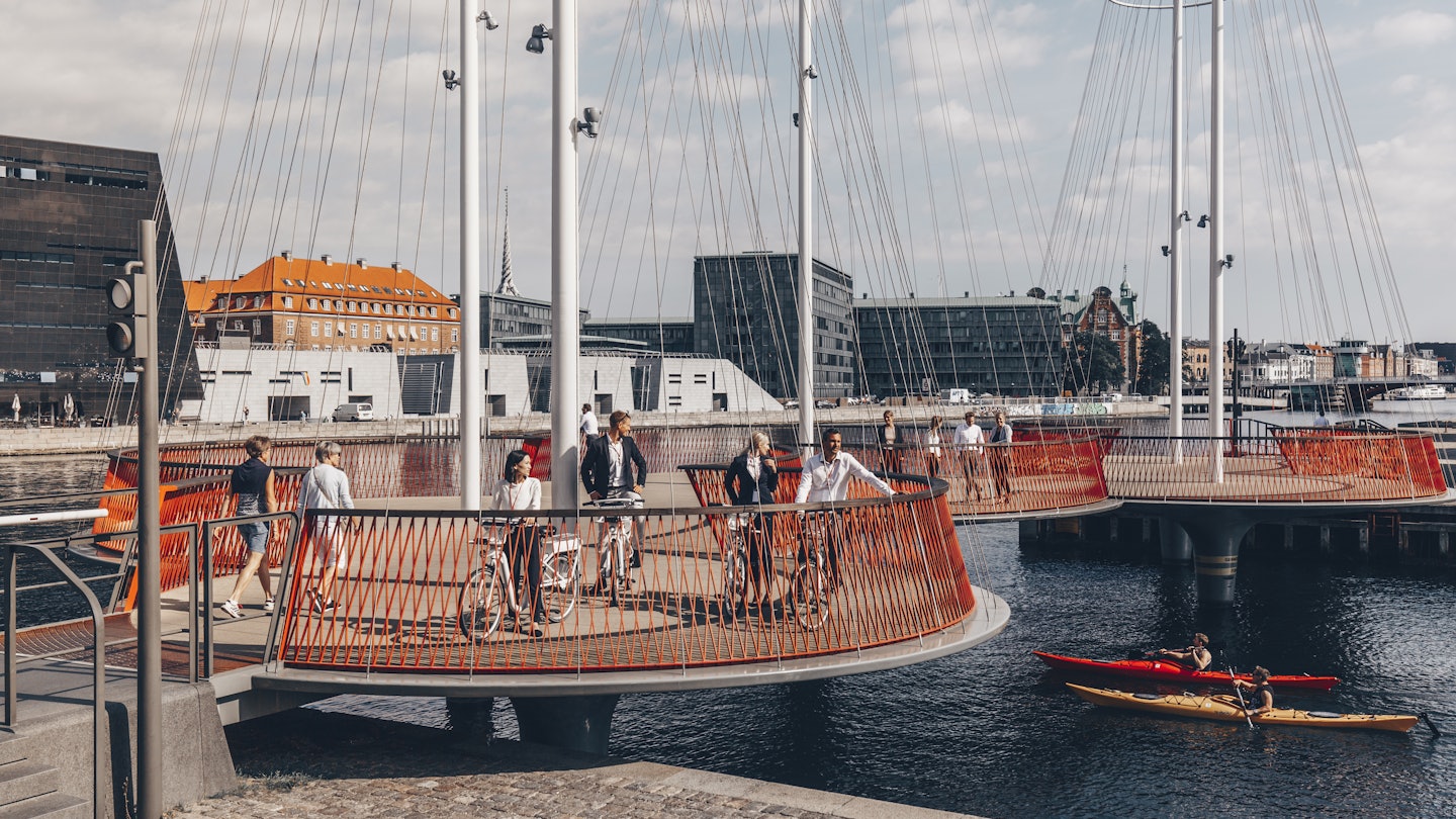 People walking and biking across the Circle Bridge in Copenhagen