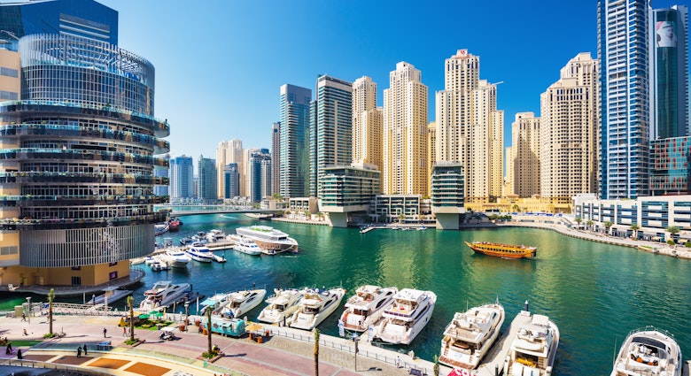 DUBAI MARINA ,UNITED ARAB EMIRATES-FEBRUARY 28, 2017: Promenade and canal in Dubai Marina with luxury skyscrapers around,United Arab Emirates License Type: media Download Time: 2023-11-20T02:03:53.000Z User: mvm_lonelyplanet Is Editorial: Yes purchase_order:
