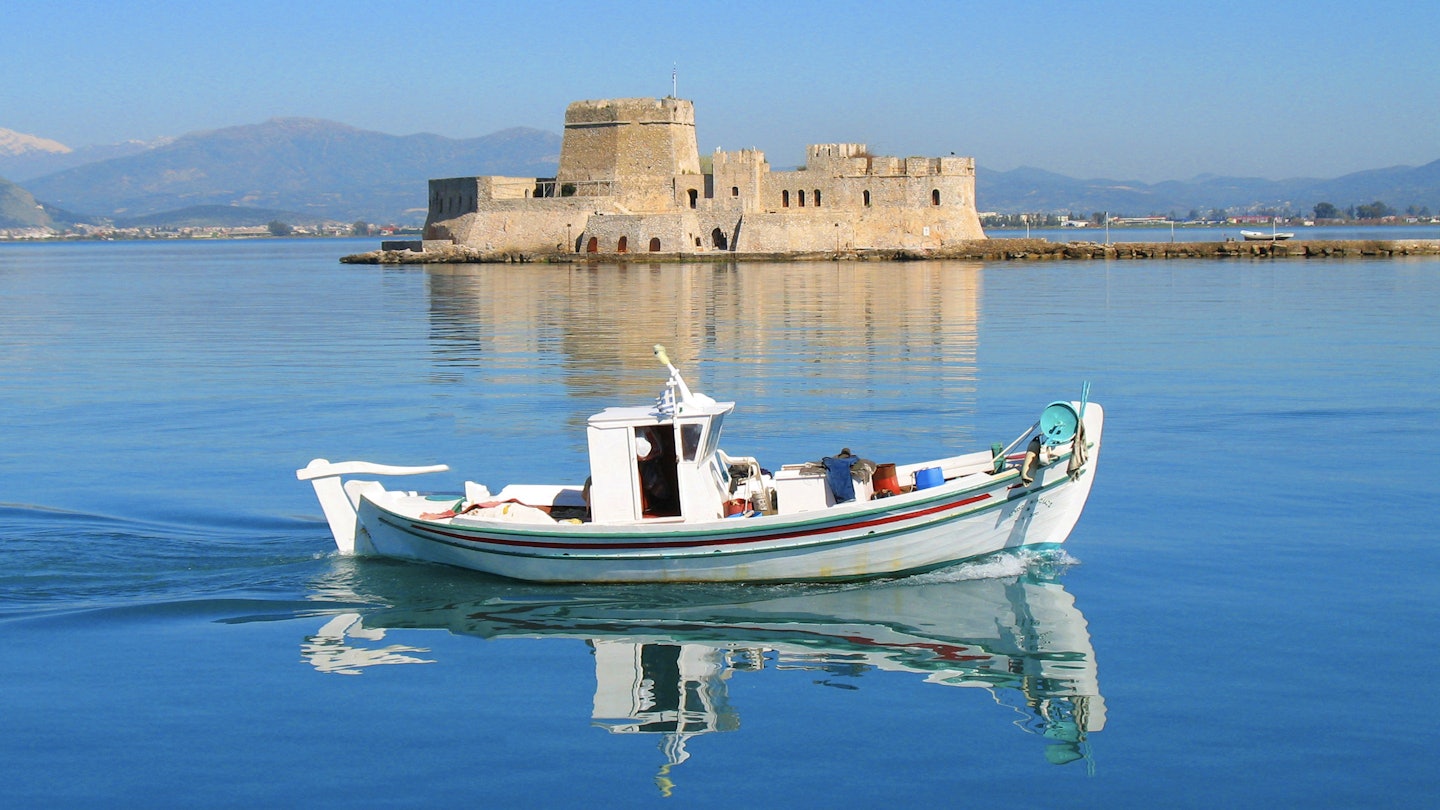 Traditional fishing boat cruising in calm sea of picturesque city of Nafplio and Bourtzi fortress at the background , Argolida, Peloponnese, Greece License Type: media Download Time: 2023-01-28T13:02:51.000Z User: Norma.PrauseBrewer_LonelyPlanet Is Editorial: No purchase_order:
Boat, Building, Castle, Fortress, Person, Vehicle, Water, Watercraft, Waterfront
Traditional fishing boat cruising in calm sea of picturesque city of Nafplio and Bourtzi fortress at the background , Argolida, Peloponnese, Greece