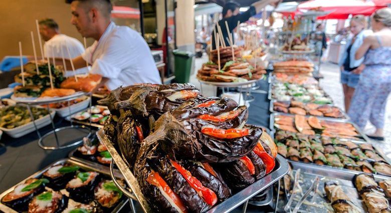 PALERMO, ITALY: Grilled vegetables, stuffed eggplantand, local street snacks on stall of traditional farm market on 10 October 2019. Sicily is Italian region with highest number of expatriates
1614083095
agriculture, bio, buffet, buy, city, cooked, delicacy, dinner, eat, eating, eco, eggplant, farm, farmer, food, fresh, freshness, gourmet, green, grilled, healthy, italian, italy, lunch, market, marketplace, meal, mediterranean, natural, nutrition, organic, palermo, pepper, piece, plate, restaurant, retail, seller, shop, sicily, slice, store, street, summer, trading, traditional, vegan, vegetable, vegetarian, zucchini