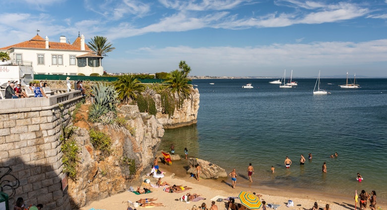 CASCAIS, PORTUGAL - OCTOBER 7, 2020: Beach full of locals and tourists on a sunny summer weekend, License Type: media, Download Time: 2025-02-11T21:53:42.000Z, User: rhylton_redventures, Editorial: true, purchase_order: 65030 - Newsletter, job: Lonely Planet WIP, client: Lonely Planet WIP, other: Rhianydd Hylton